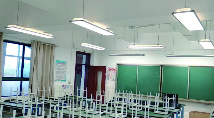 Classroom in Jieyang with suspended rectangular lights and green teaching boards