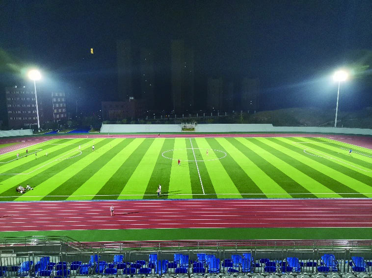 Luotian Sports Centre football field and running track viewed from the spectator side